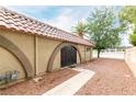 Charming single-story home featuring arched entryways, desert landscaping, and a tile roof at 848 Hedge Way # 5, Las Vegas, NV 89110