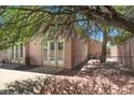 The backyard features a fenced pool, desert landscaping, and a covered patio area at 8612 Chiquita Dr, Las Vegas, NV 89128