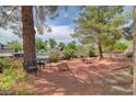 A backyard is set up with a table and chairs perfect for entertaining and relaxation at 872 N Linn Ln, Las Vegas, NV 89110