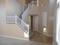 Open entryway with staircase and tile flooring at 9709 Port Orange Ln, Las Vegas, NV 89134