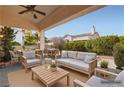 Inviting covered patio with comfortable seating, perfect for outdoor entertaining and relaxation at 9920 Netherton Dr, Las Vegas, NV 89134