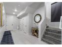 The home's entryway features a modern design, stylish decor, and elegant staircase at , Las Vegas, NV 89135