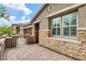Close up of the front exterior with a paved driveway and walkway, and a gated courtyard at 10182 Skye Run Ave, Las Vegas, NV 89166