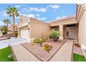 Home featuring desert landscaping, an attached garage, and a decorative stone pathway at 10508 Snyder Ave, Las Vegas, NV 89134