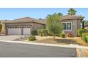 Well-maintained single-story home featuring a three-car garage and mature landscaping at 1314 Doggett Ave, Las Vegas, NV 89123