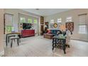 Spacious living room with large windows, neutral tones and modern finishes at 1314 Doggett Ave, Las Vegas, NV 89123