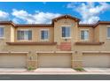 Townhome garages offer convenient parking, each clearly numbered with the unit address above at 1525 Spiced Wine Ave # 12103, Henderson, NV 89074