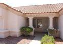 Inviting front entrance features decorative pillars and well-maintained landscaping at 3001 Anna Bay Dr, Las Vegas, NV 89134