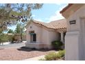 Charming house showcasing a beautiful terracotta tile roof and desert landscaping at 3001 Anna Bay Dr, Las Vegas, NV 89134