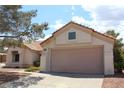 A lovely one-story home featuring a two-car garage and beautifully designed tile roofing at 3001 Anna Bay Dr, Las Vegas, NV 89134