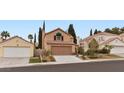 Charming home with front yard landscaping, two car garage, and neutral color palette at 3217 Harbor Vista St, Las Vegas, NV 89117