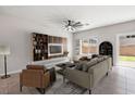 Bright living room features stylish decor, comfortable seating, and seamless access to the backyard at 4039 Beech Fern Ave, North Las Vegas, NV 89084