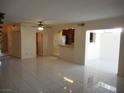 Spacious open-concept living area with tile floors and easy access to the kitchen at 5006 Schumann Dr, Las Vegas, NV 89146