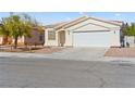 Lovely single-story home with a two-car garage and desert landscaping for low maintenance at 5307 Wild Orchid St, North Las Vegas, NV 89031