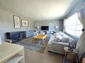 Inviting living room boasts neutral tones, comfortable seating, and ample natural light at 5704 Heron Ave, Las Vegas, NV 89107