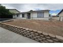 Inviting single-story home featuring a cozy design and simple landscaping at 6500 Hill View Ave, Las Vegas, NV 89107
