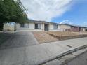 Neat single-story home with a paved driveway and minimalist front yard design at 6500 Hill View Ave, Las Vegas, NV 89107