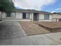 Classic single-story home with a tidy front yard and a paved entrance at 6500 Hill View Ave, Las Vegas, NV 89107