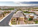 A beautiful single-story home with lush landscaping and an attractive brick driveway in a suburban neighborhood at 6728 Regency Ridge Ct, Las Vegas, NV 89148