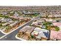 A beautiful home surrounded by a well-maintained neighborhood with mature trees and paved streets at 6728 Regency Ridge Ct, Las Vegas, NV 89148