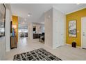 Inviting hallway with tile flooring, neutral walls, and decorative accents at 7208 Grace Estate Ave, Las Vegas, NV 89113
