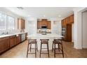 Bright kitchen with a large center island, stainless steel appliances and ample counter space at 7466 Matilda St, Las Vegas, NV 89113