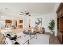 Open-concept living room featuring stylish furniture, neutral tones, and abundant natural light at 7466 Matilda St, Las Vegas, NV 89113