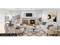 Bright, airy living room with modern furniture and a fireplace below the mounted television at 7936 Pinnochio Ave, Las Vegas, NV 89131