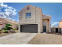Inviting front exterior with well-maintained desert landscaping and an attached two-car garage at 9328 Jumpin Juniper Ave, Las Vegas, NV 89129
