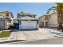 Charming two-story house boasting a well-manicured lawn, desert landscaping, and a convenient two-car garage at 1352 Angel Falls St, Las Vegas, NV 89142