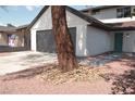 Charming two-story home featuring a spacious driveway and landscaped front yard at 1805 Amboy Dr, Las Vegas, NV 89108
