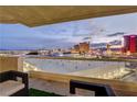 Enjoy the spectacular city view from this spacious balcony with sleek glass railings and comfortable seating area at 2877 Paradise Rd # 1605, Las Vegas, NV 89109