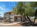Apartment building featuring pedestrian access, landscaping and on a sunny day at 2898 Violet Ln # 0, Henderson, NV 89074