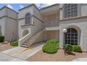 Exterior of condo building featuring stair access and neutral stucco at 3150 Soft Breezes Dr # 2186, Las Vegas, NV 89128
