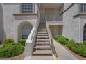 Exterior staircase leading to upper level condos with secure front doors at 3150 Soft Breezes Dr # 2186, Las Vegas, NV 89128