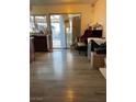 The living room has hardwood flooring and lots of natural light at 4017 Edgeford Pl, Las Vegas, NV 89102