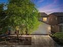 Inviting two-story home with a well-maintained lawn, a two car garage, and desert landscaping at 4905 Apache Valley Ave, Las Vegas, NV 89131