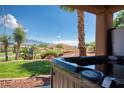 Backyard hot tub with mountain and golf course views, perfect for relaxation at 522 Via Ventana Dr, Mesquite, NV 89027