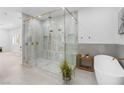Luxurious bathroom showcasing a spacious glass shower and modern tub at 5225 Villa Dante Ave, Las Vegas, NV 89141