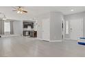 Open concept living and dining area features neutral walls, modern floors and seamlessly connects to the kitchen at 626 Taliput Palm Pl, Henderson, NV 89011