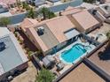 Aerial view of a home showcasing its backyard oasis with a pool and well-manicured desert landscaping at 6292 Belgium Dr, Las Vegas, NV 89122