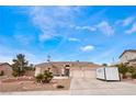 Charming single-story home featuring a well-manicured yard and a three-car garage at 7076 Oakleigh Dr, Las Vegas, NV 89110