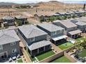 A beautiful aerial view of a suburban neighborhood with desert scenery in the background at 7456 Tinley Creek Ave, Las Vegas, NV 89113