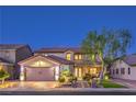 Charming two-story home exterior at twilight showcasing manicured lawn and a brick driveway at 7908 Horse Bridle St, Las Vegas, NV 89131