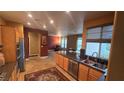 Open-concept kitchen featuring stainless steel appliances, granite countertops, and ample cabinet space, flowing into the living area at 9900 Summer Ash Ct # 101, Las Vegas, NV 89134