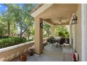Covered patio featuring neutral tones, a ceiling fan, and an outdoor seating area at 9900 Summer Ash Ct # 101, Las Vegas, NV 89134