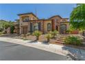 Charming two-story home with a three-car garage and well-maintained landscaping at 9992 Peak Lookout St, Las Vegas, NV 89178