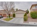 Inviting single-story home with a neutral stucco exterior, a two-car garage, and low maintenance desert landscaping at 10605 Moon Flower Arbor Pl, Las Vegas, NV 89144