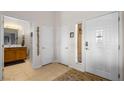 Bright foyer featuring tiled flooring and a view of the adjacent bathroom at 1187 Mohave Dr, Mesquite, NV 89027