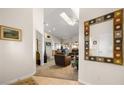 Open-concept living room featuring a skylight and views into the kitchen at 1187 Mohave Dr, Mesquite, NV 89027